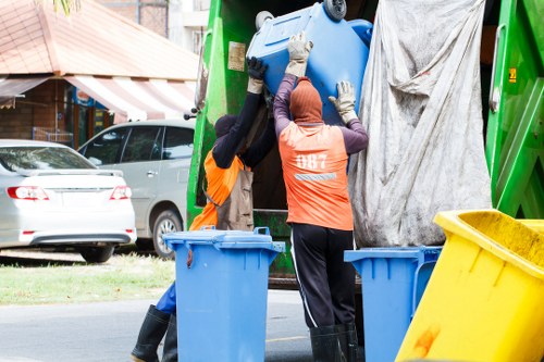 Inspector reviewing waste containers at a commercial site